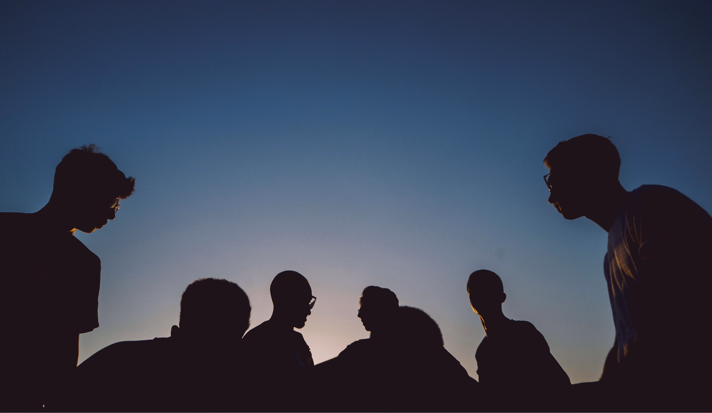 Friends gathered together at dusk